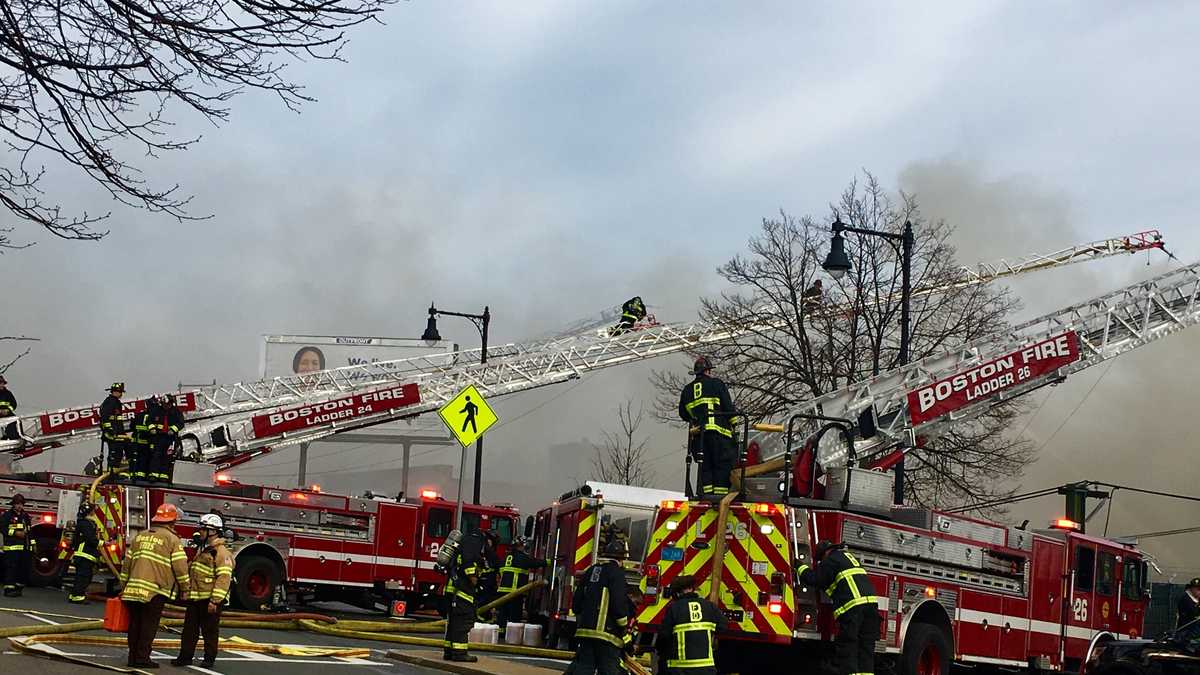 Raging fire at East Boston business prompts evacuations, MBTA disruption