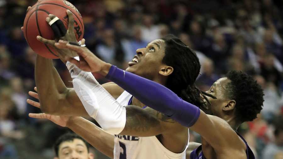 Kansas State guard Cartier Diarra (2) shoots as TCU guard RJ Nembhard, right, defends during the first half of an NCAA college basketball game in the quarterfinals of the Big 12 conference tournament in Kansas City, Mo., Thursday, March 14, 2019. (AP Photo/Orlin Wagner)
