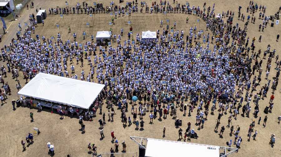 This photo taken by a drone and provided by the City of Kyle, Texas, shows an attempt by the city to break the world record for the largest gathering of people with one name, Saturday, May 18, 2024.