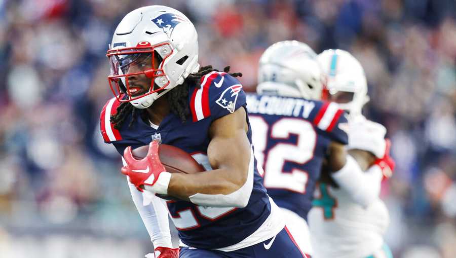 New England Patriots safety Kyle Dugger (23) heads towards the end zone, after intercepting the ball, on his touchdown run against the Miami Dolphins the during the second half of an NFL football game, Sunday, Jan. 1, 2023, in Foxborough, Mass. (AP Photo/Michael Dwyer)