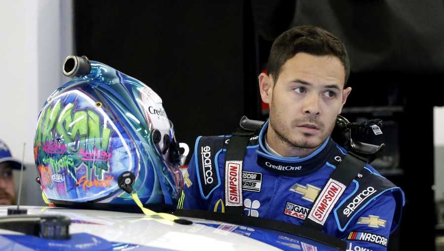 In this Feb. 14, 2020, file photo, Kyle Larson gets ready to climb into his car to practice for the NASCAR Daytona 500 auto race at Daytona International Speedway in Daytona Beach, Fla. Kyle Larson used a racial slur on a live stream Sunday. April 12, 2020, during a virtual race — the second driver in a week to draw scrutiny while using the online racing platform to fill time during the coronavirus pandemic.