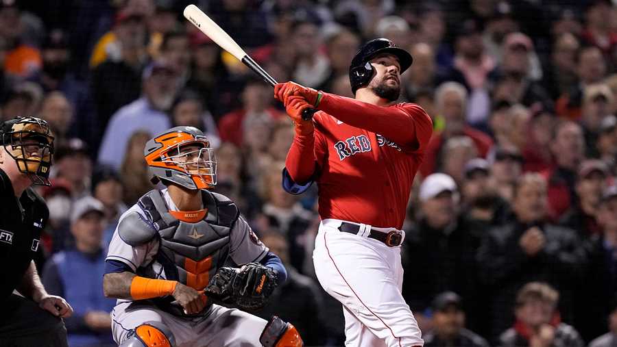 Boston Red Sox's Kyle Schwarber hits a grand slam home run against the Houston Astros during the second inning in Game 3 of baseball's American League Championship Series Monday, Oct. 18, 2021, in Boston. (AP Photo)