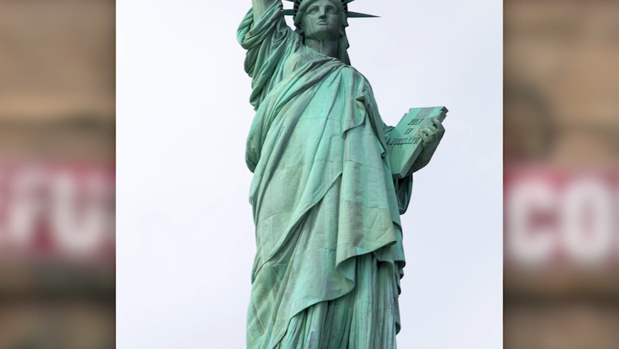 Refugees Welcome' Banner on Statue of Liberty