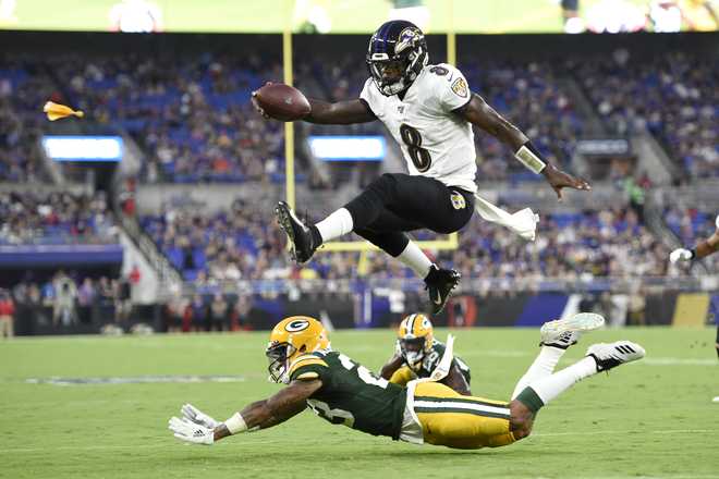 Lamar Jackson recreates famous hurdle over familiar face in