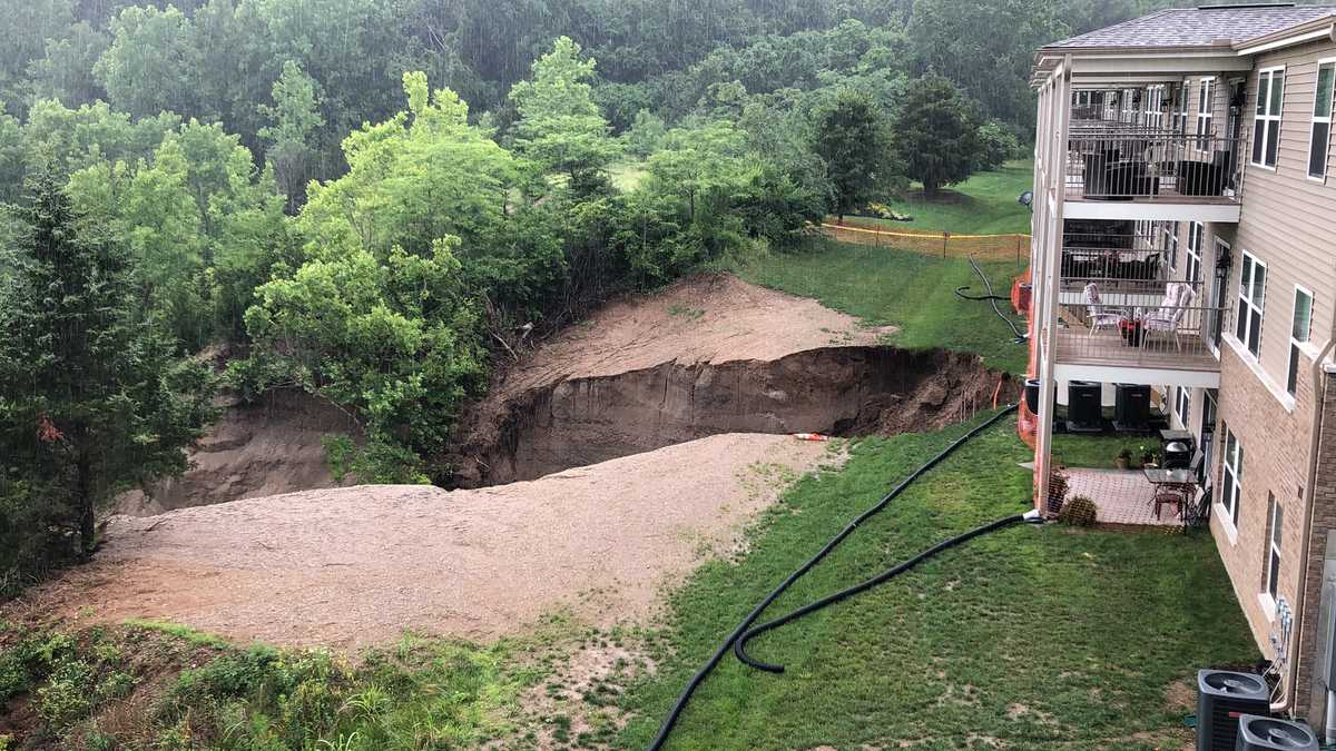 Residents push for answers as sinkhole behind Harrison condos grows