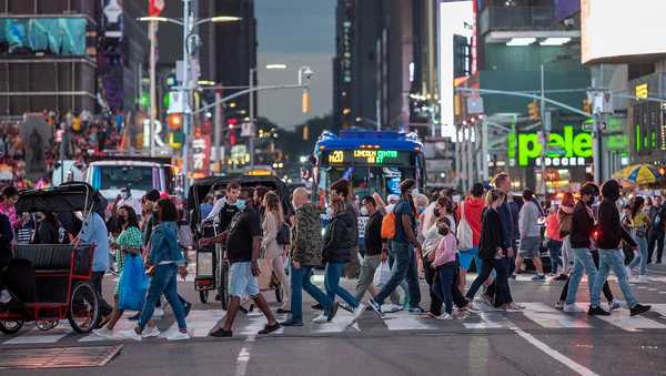 NEW YORK, NEW YORK - JUNE 12: Large crowds of people mostly without masks fill Times Square  on June 12, 2021 in New York City.