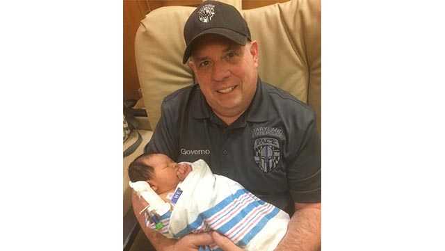Gov. Larry Hogan holds his newborn grandson, Cam Sterling