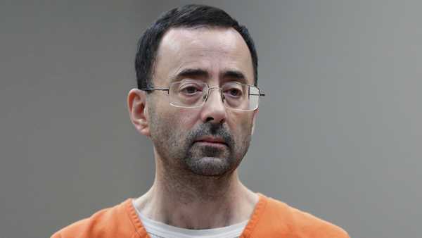 In this Nov. 22, 2017 file photo, Dr. Larry Nassar appears in court for a plea hearing in Lansing, Mich.