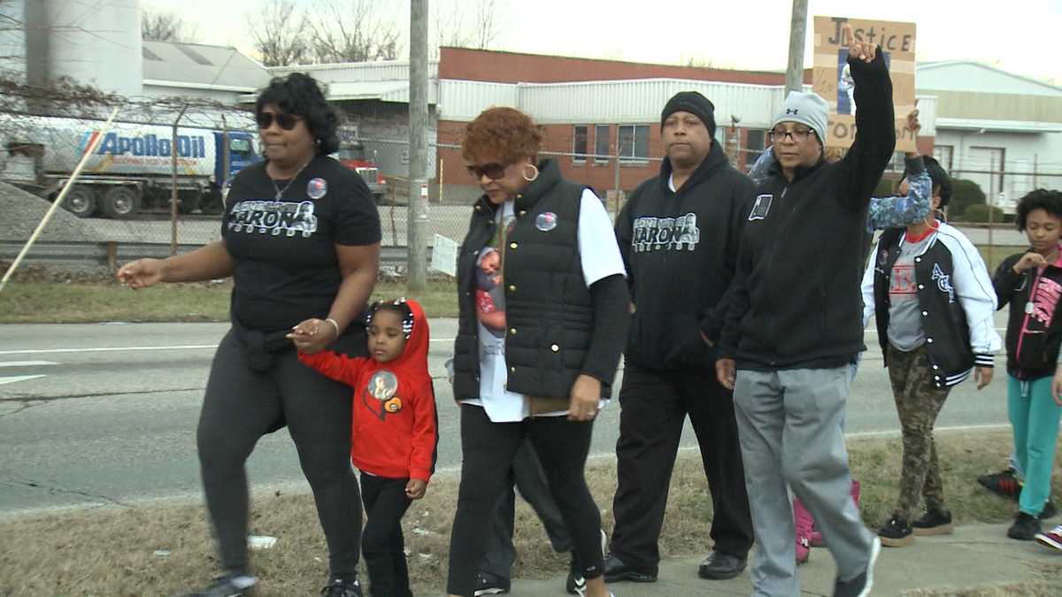 IMAGES: Family, friends march for justice year after homicide