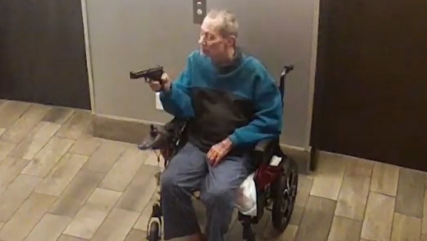 Charles Alan Leonard III, 70, is seen holding a gun in this screenshot of a video taken Nov. 26, 2024, inside the Elsie Mason Manor apartment complex in Des Moines.