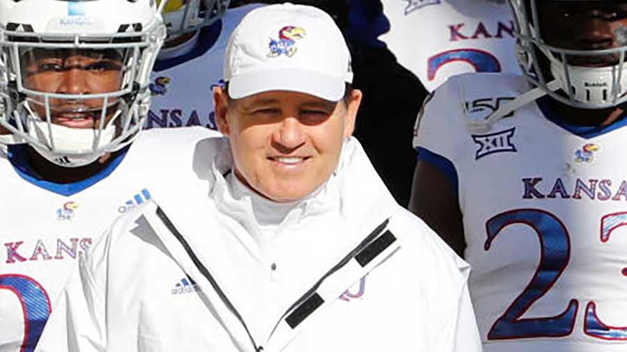 AMES, IA - NOVEMBER 23: Head coach Les Miles of the Kansas Jayhawks and his team take the field at Jack Trice Stadium on November 23, 2019 in Ames, Iowa. The Iowa State Cyclones won 41-31 over the Kansas Jayhawks. (Photo by David K Purdy/Getty Images)