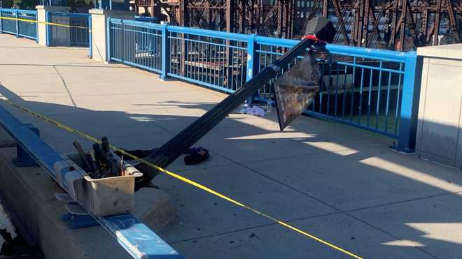 A photo obtained by 5 Investigates shows a light post on the Evelyn  x20;Moakley Bridge that a source says fell onto a woman who was  walking across the bridge on Sept. 27, 2022.