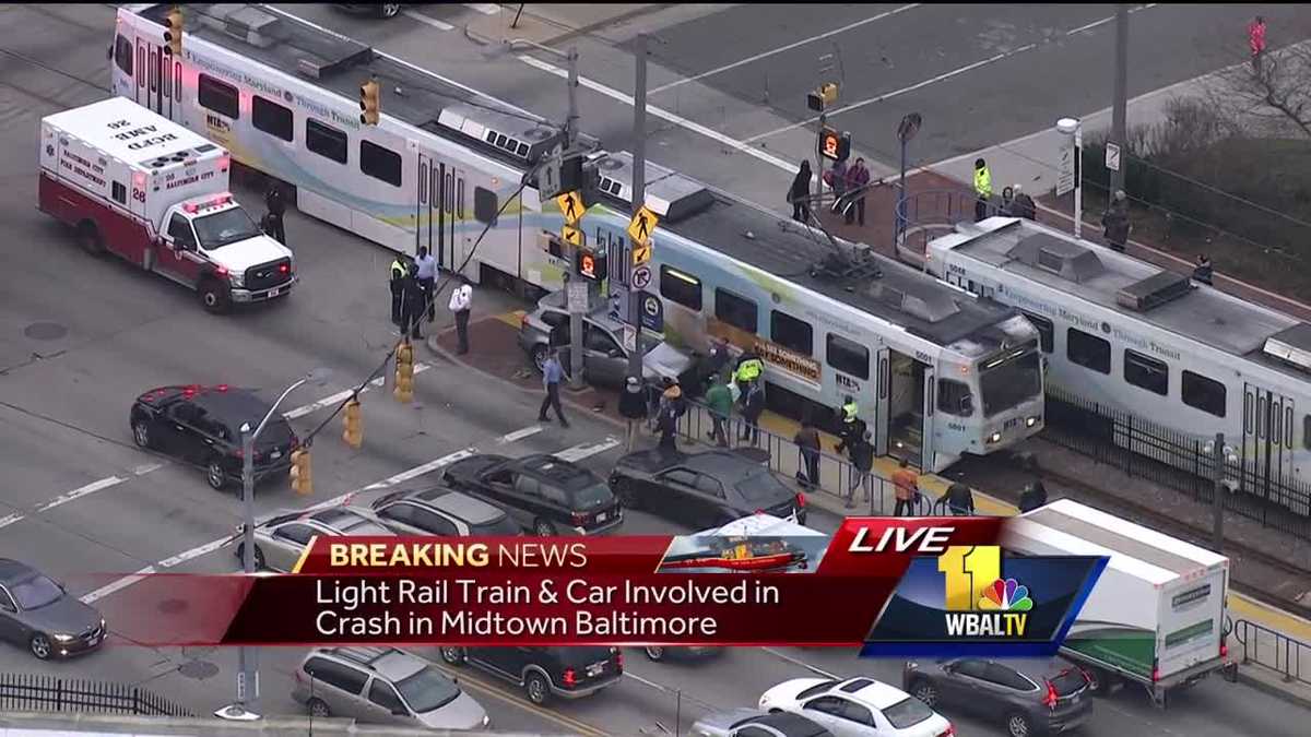 Light rail train, car collide in midtown Baltimore