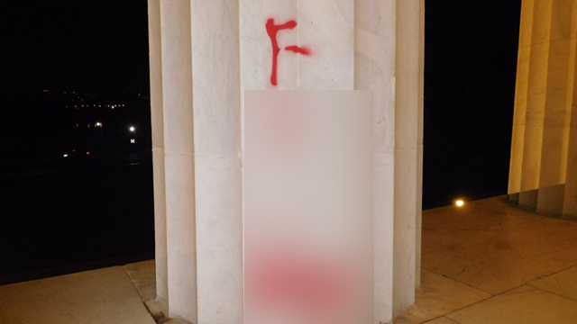 This photo, which has been blurred for graphic content, shows the graffiti left on the Lincoln Memorial early Tuesday, August 15, 2017.