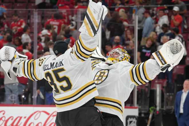 Boston Bruins goaltenders Jeremy Swayman and Linus Ullmark (#35) celebrate after a 2-1 win after Game 5 of the Eastern Conference Round 2 playoffs between the Boston Bruins and the Florida Panthers on Tuesday, May 14, 2024 at Amerant Bank Arena in Sunrise, Florida.