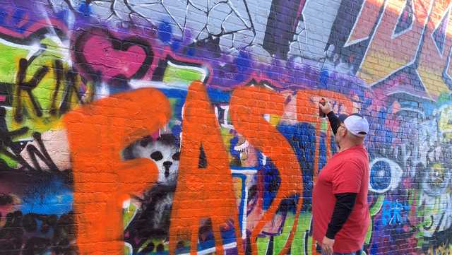Volunteers paint graffiti to highlight stroke symptoms - Vimarsana News