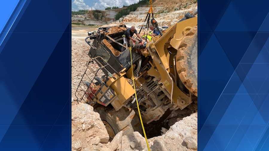 Frontend loader operator injured after backing off cliff