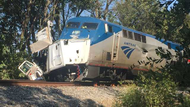 Truck dragged 3,900 feet after train collision, authorities say