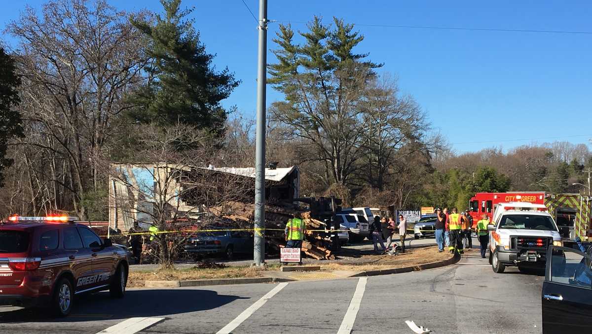Vehicle crashes into building, injury reported, fire officials say