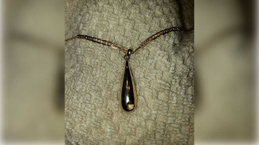 A woman is searching for this lost pendant that carries her daughter's ashes.