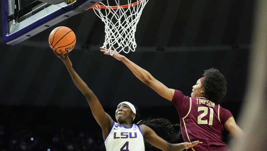 LSU guard Flau&apos;Jae Johnson (4) drives to the basket against Florida State forward Makayla Timpson (21) during the first half in the second round of the NCAA college basketball tournament.