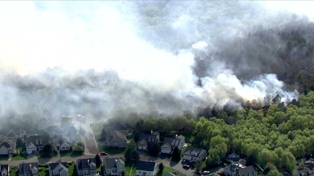 Large brush fire approaches homes near Lynn Woods