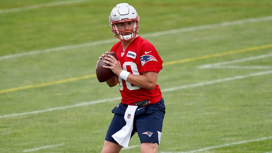 New England Patriots quarterback Mac Jones drops back to pass during a NFL football practice in Foxborough, Mass., Friday, June 4, 2021. (AP Photo)