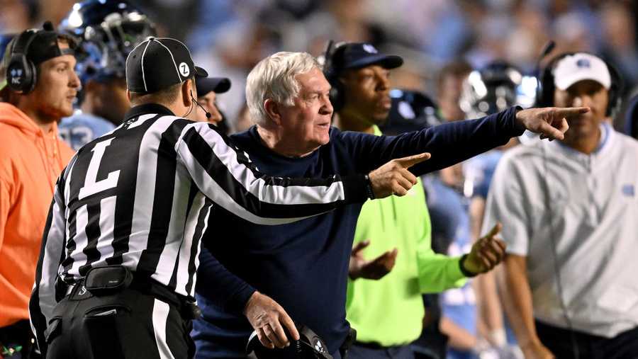 Head coach Mack Brown of the North Carolina Tar Heels argues with an official during their game against the North Carolina State Wolfpack at Kenan Memorial Stadium on Nov. 25, 2022, in Chapel Hill, North Carolina. The Wolfpack won 30-27 in overtime.