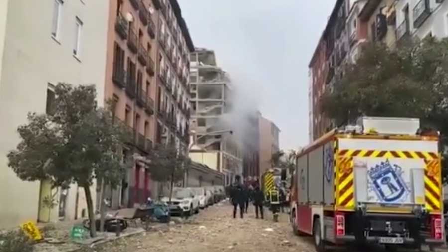 In this image made from video provided by Emergencias Madrid, firefighters attend the scene after an explosion in Madrid, Wednesday, Jan. 20, 2021.