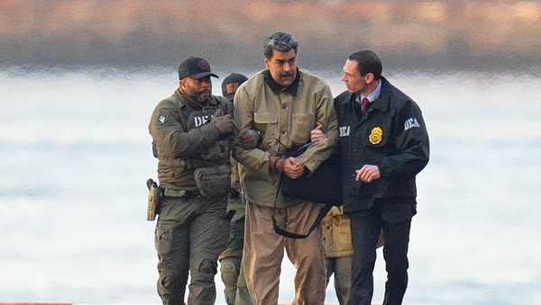 Nicolas Maduro is seen in handcuffs after landing at a Manhattan helipad, escorted by heavily armed Federal agents as they make their way into an armored car en route to a Federal courthouse in Manhattan on January 5, 2026 in New York City.
