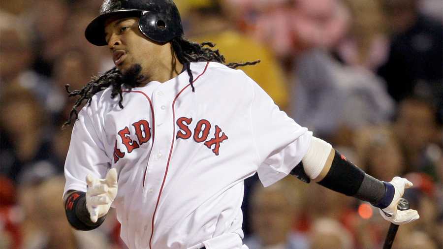 In this file photo, Boston Red Sox's Manny Ramirez watches his double to left field during the third inning of a baseball game against the New York Yankees at Fenway Park in Boston, Sunday, July 27, 2008..