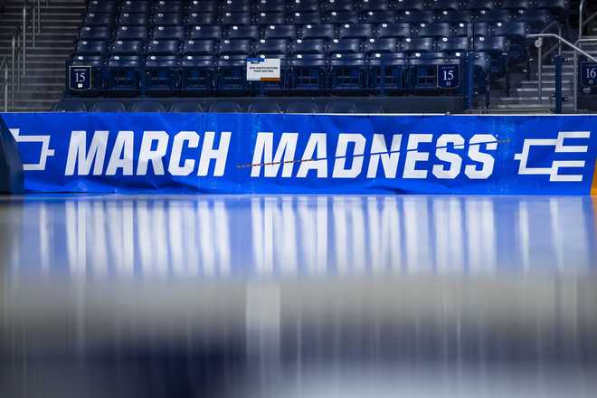 March Madness branding near the court before a first-round college basketball game.