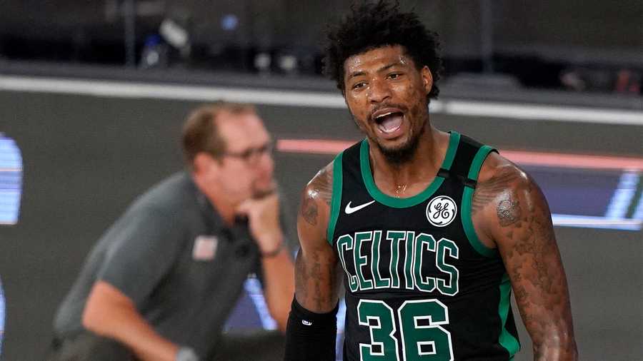 Boston Celtics' Marcus Smart (36) celebrates after sinking a basket and drawing a foul in the second half of an NBA conference semifinal playoff basketball game against the Toronto Raptors on Tuesday, Sept. 1, 2020, in Lake Buena Vista, Fla. (AP Photo/Mark J. Terrill)