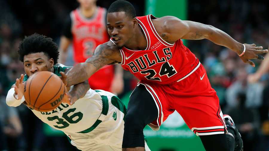 Chicago Bulls' Javonte Green (24) battles Boston Celtics' Marcus Smart (36) for a loose ball during the first half of an NBA basketball game, Monday, Nov. 1, 2021, in Boston. (AP Photo)