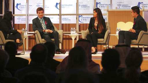 Moderator Vijita Patel, left, Parkland High School students Lewis Mizen, second left, Suzanna Barna, third left, and Kevin Trejos, right, hold a discussion on stage at the Global Education and Skills Forum in Dubai, United Arab Emirates, Saturday, March 17, 2018.