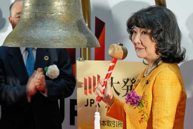 Finance Minister Satsuki Katayama rings the bell during a ceremony marking the start of trading at the Tokyo Stock Exchange, Monday, Jan. 5, 2026, in Tokyo.