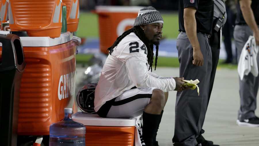 Oakland Raiders running back Marshawn Lynch (24) sits during the national anthem prior to an NFL preseason football game against the Arizona Cardinals, Saturday, Aug. 12, 2017, in Glendale, Ariz.