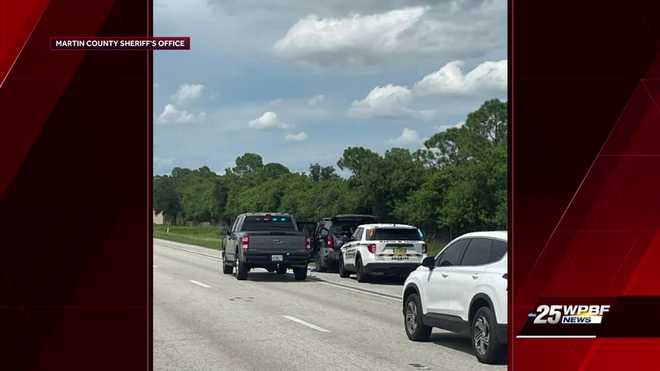 This photo provided by the Martin County Sheriff's Office shows Sheriff's vehicles surrounding an SUV on the northbound I-95 in Martin County on Sunday, Sept. 15, 2024.