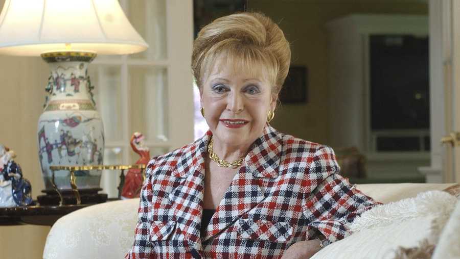 In this June 3, 2004 file photograph, author Mary Higgins Clark poses in her home in Saddle River, N.J. Clark, the tireless and long-reigning "Queen of Suspense" whose tales of women beating the odds made her one of the world's most popular writers, died Friday, Jan. 31, 2020, at age 92. Clark's publisher, Simon & Schuster, announced that Clark died in Naples, Fla, of natural causes.