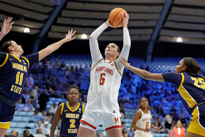 Maryland guard Saylor Poffenbarger (6) attempts a shot against Murray State guards Keslyn Secrist (11) and Destiny Thomas (25) during the second half in the first round of the NCAA college basketball tournament Friday, March 20, 2026, in Chapel Hill, N.C.