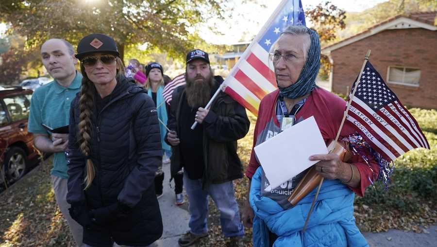 Anti-mask protestors march to the home of Utah state epidemiologist Dr. Angela Dunn Thursday, Oct. 29, 2020, in Salt Lake City.