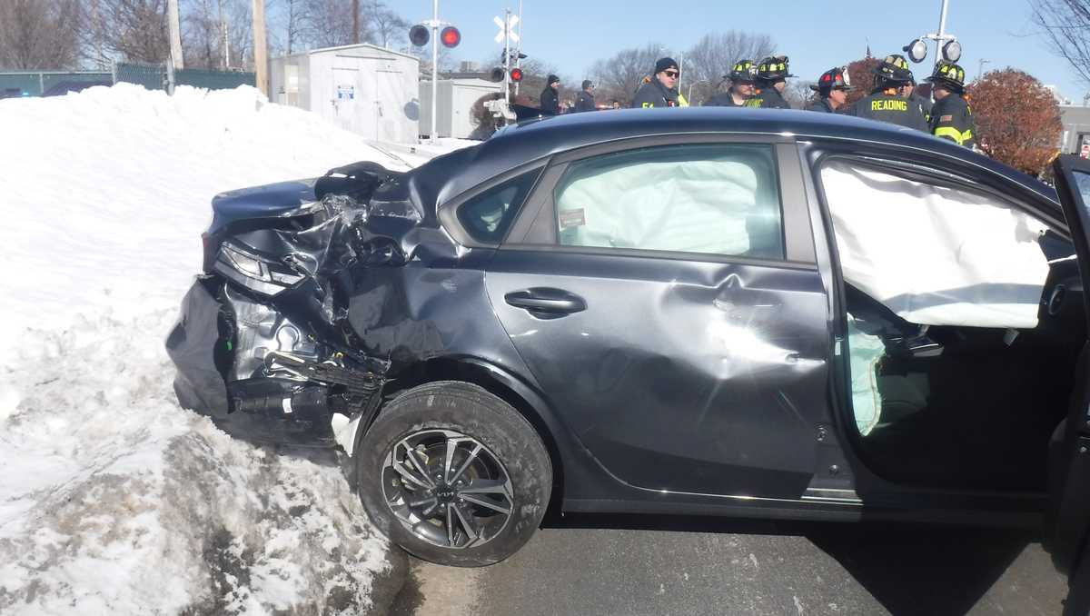 Car struck by MBTA Commuter Rail train after driver goes around safety gate in Reading, Massachusetts, police say