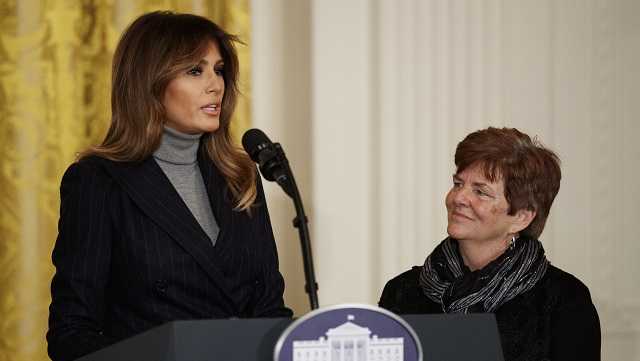 First Lady Melania Trump, joined Betty Henderson of North Fort Myers, Fla., speaks at the White House Opioid Summit in the East Room of the White House, in Washington, Thursday, March 1, 2018. 