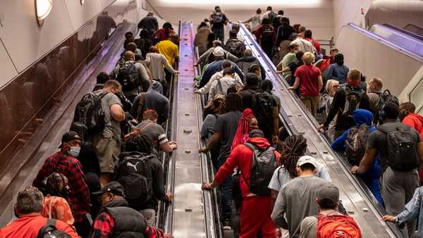 People ride up escalators on their way to baggage claim at Hartsfield-Jackson Atlanta International Airport in Atlanta, Georgia, on Friday, May 28.