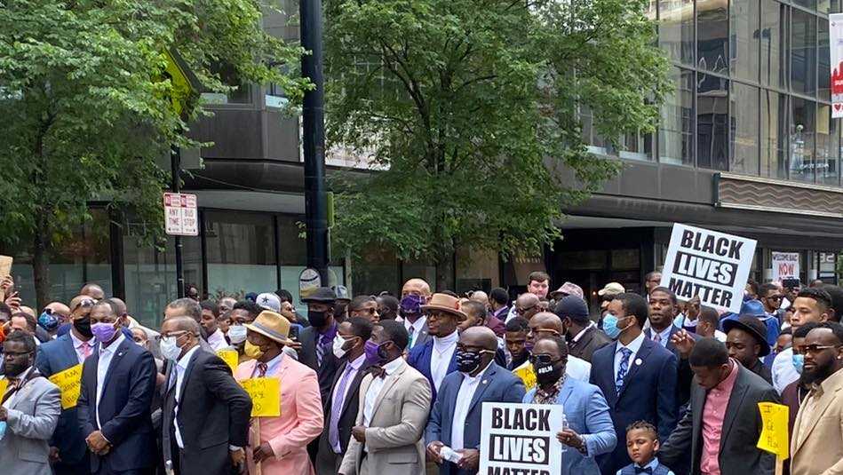 'Men in Suits' march against racial injustice in downtown Cincinnati