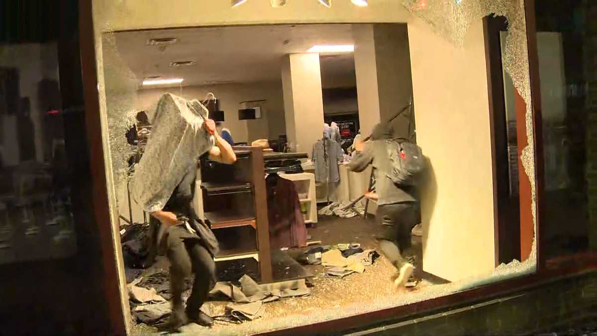 May 31, 2020, Boston, Massachusetts, USA: A looter inside Louis Vuitton  inside Copley Place in Boston. Many stores in downtown Boston were looted  following a rally against the death of George in