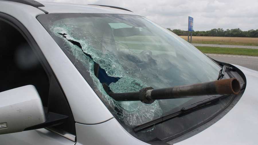 Metal rod crashes through car
