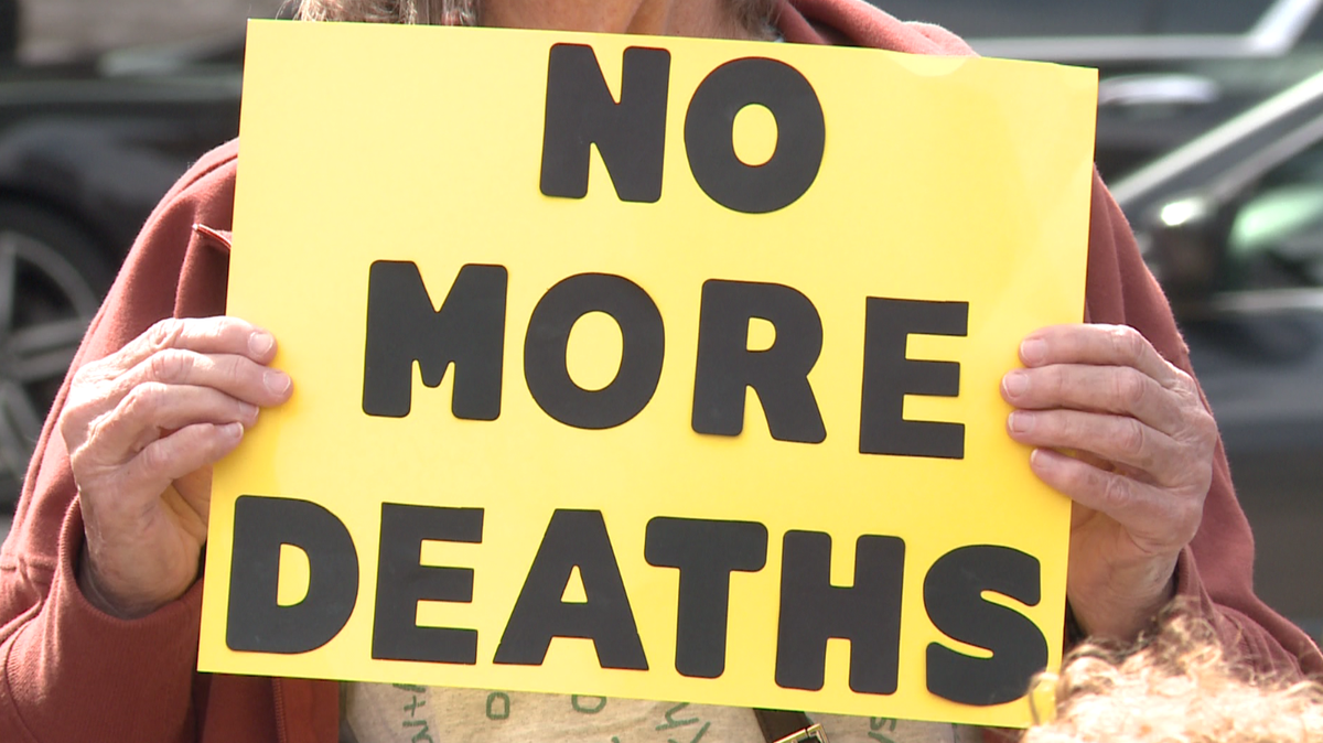 Downtown Louisville vigil puts focus on series of jail deaths