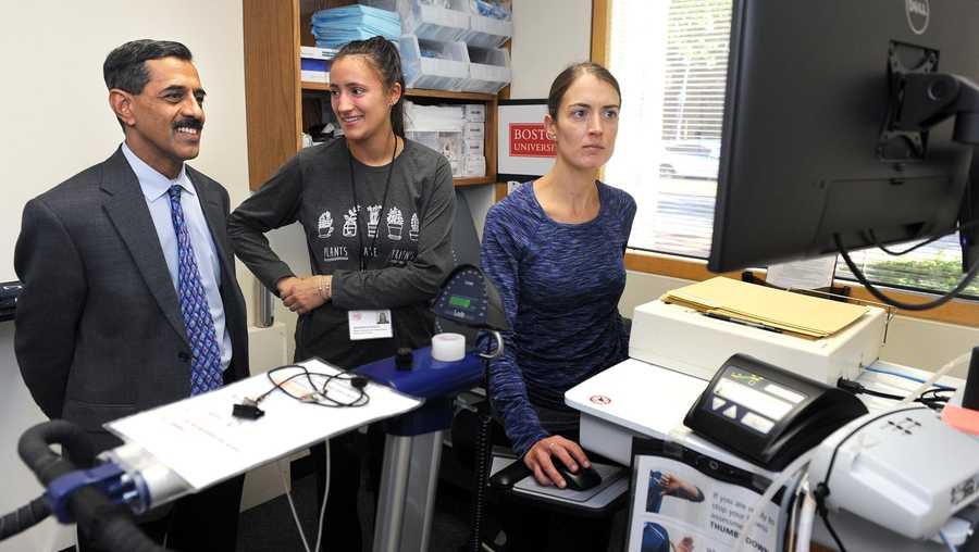 Vasan Ramachandran, lead investigator and director of the Framingham Heart Study, with exercise physiologists Melissa Tanguay, right, and Jasmine Blodgett in an exam room in October 2018.