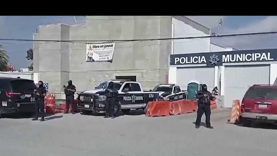 In this image made from video, Mexico&apos;s police officers stand guard at the Ensenada station in Ensenada, Mexico, Thursday, May 2, 2024.